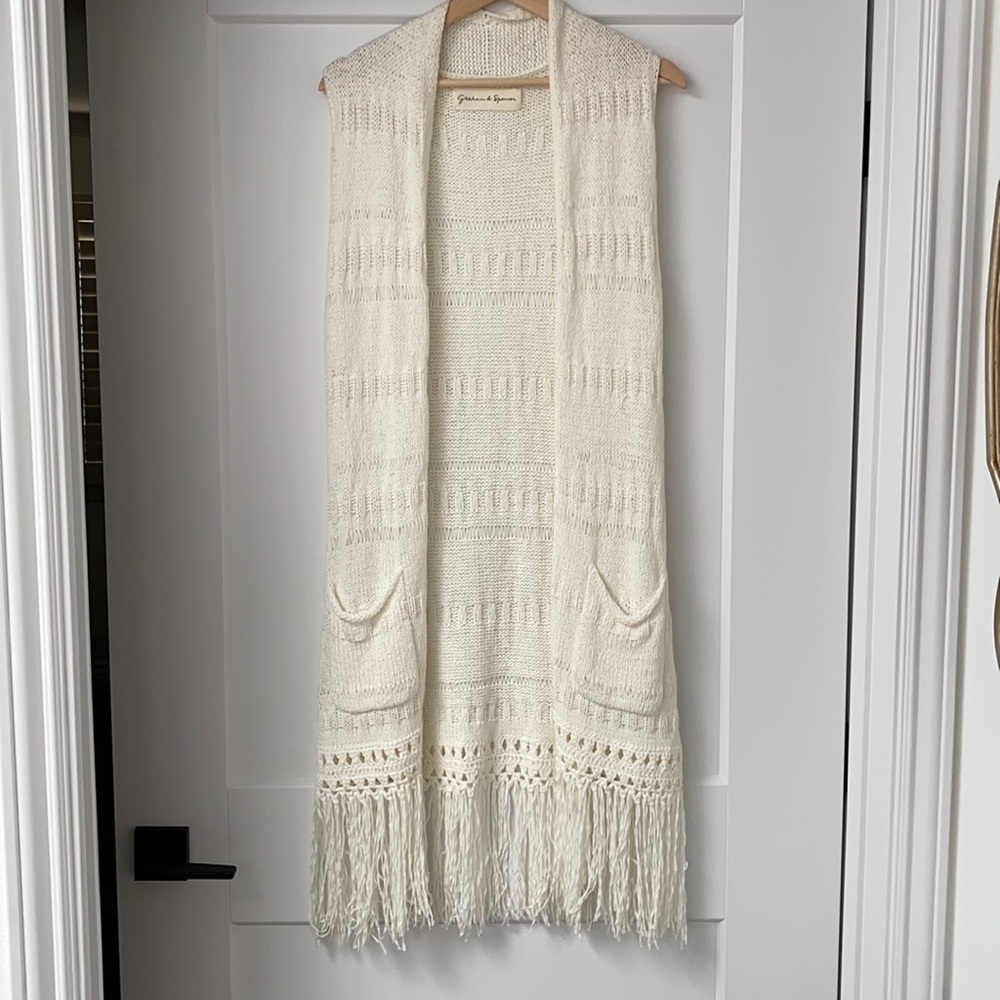 Sleeveless fringe vest.